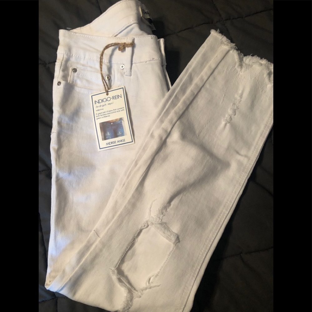Distressed ankle length white jeans